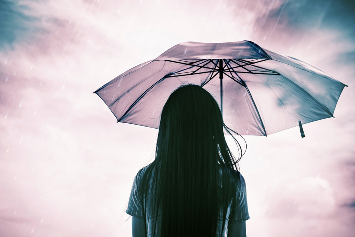 woman holding umbrella in rain