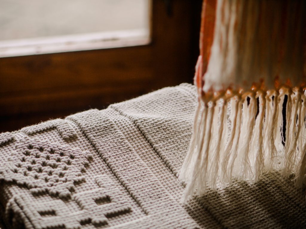 close up of rug and drapes
