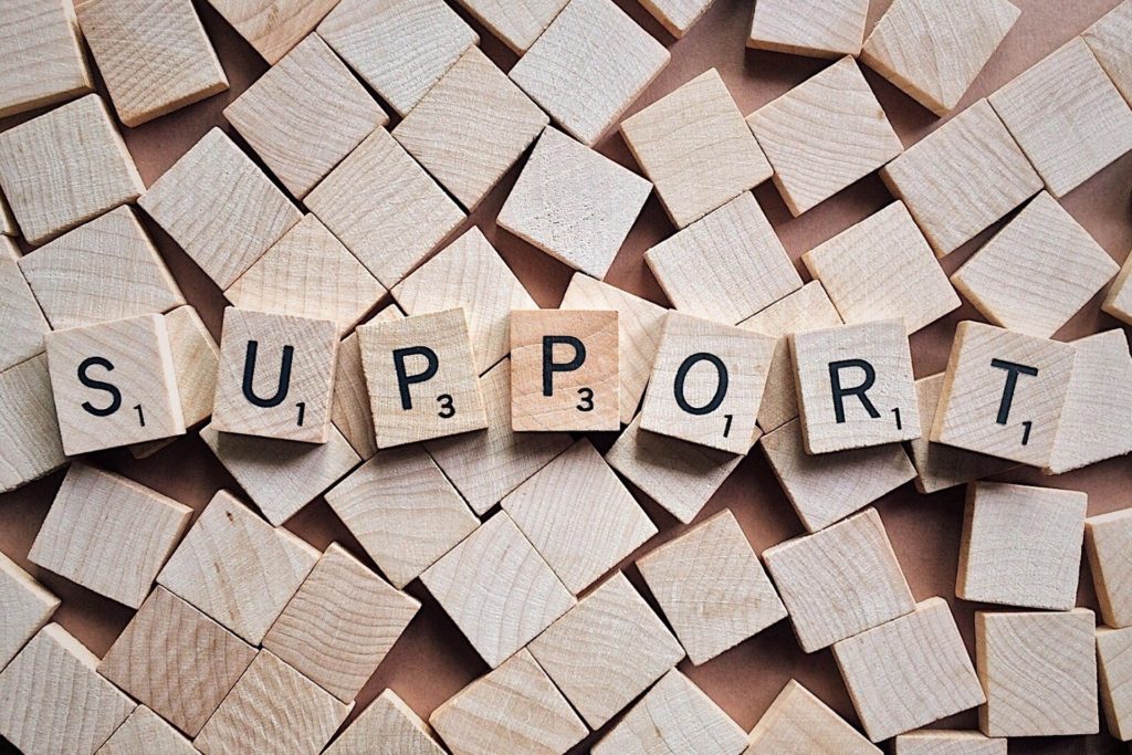support spelled with scrabble letters